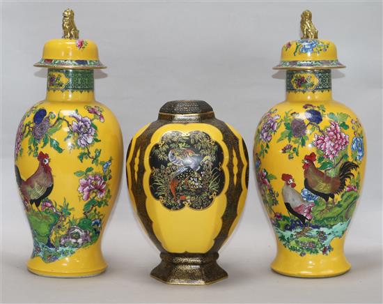 A pair of Carlton ware yellow ground vases and covers and a similar jar
